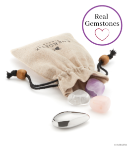 Linen bag with the Water Quartet spilling out of it - stainless steel magnet element, amethyst, rock crystal and rose quartz