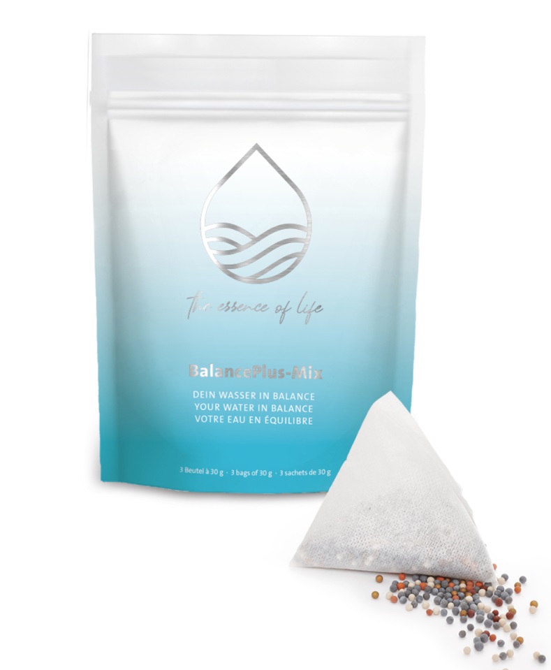 A packet of ENERGETIX BalancePlus Mix and one of the bags in front with a scattering of the mafanite stones