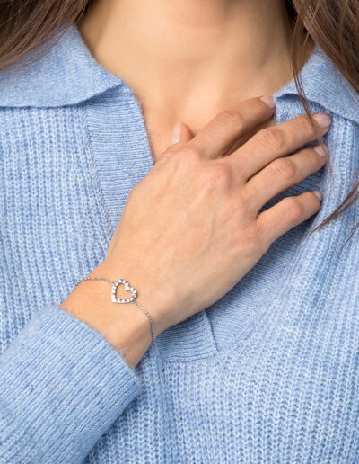 Model wearing a magnetic Bracelet with glittering heart motif